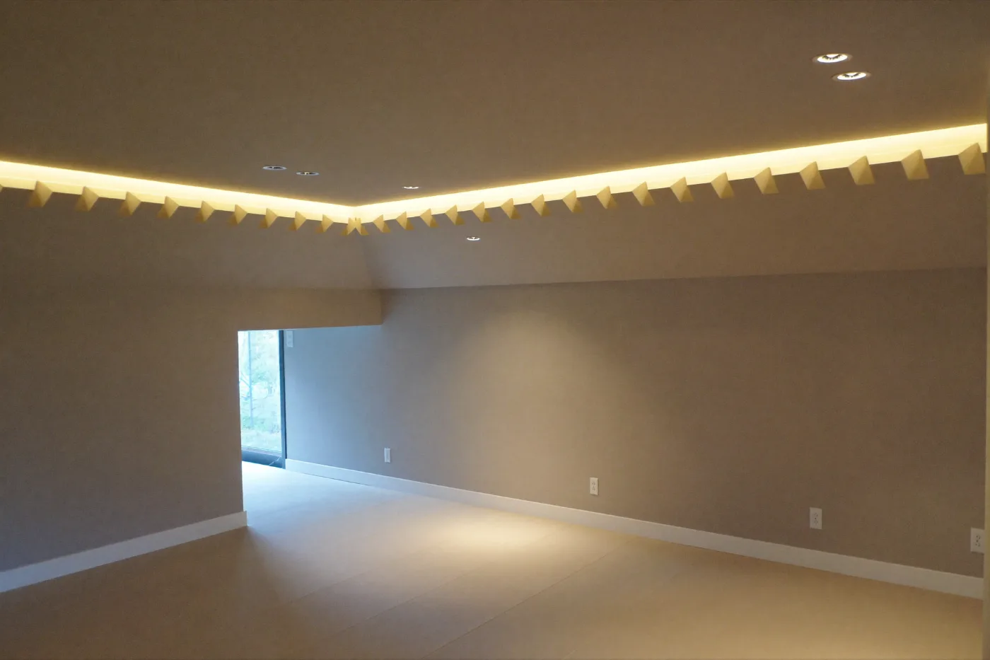 Stepped gypsum ceiling with concealed cove lighting in a finished villa room